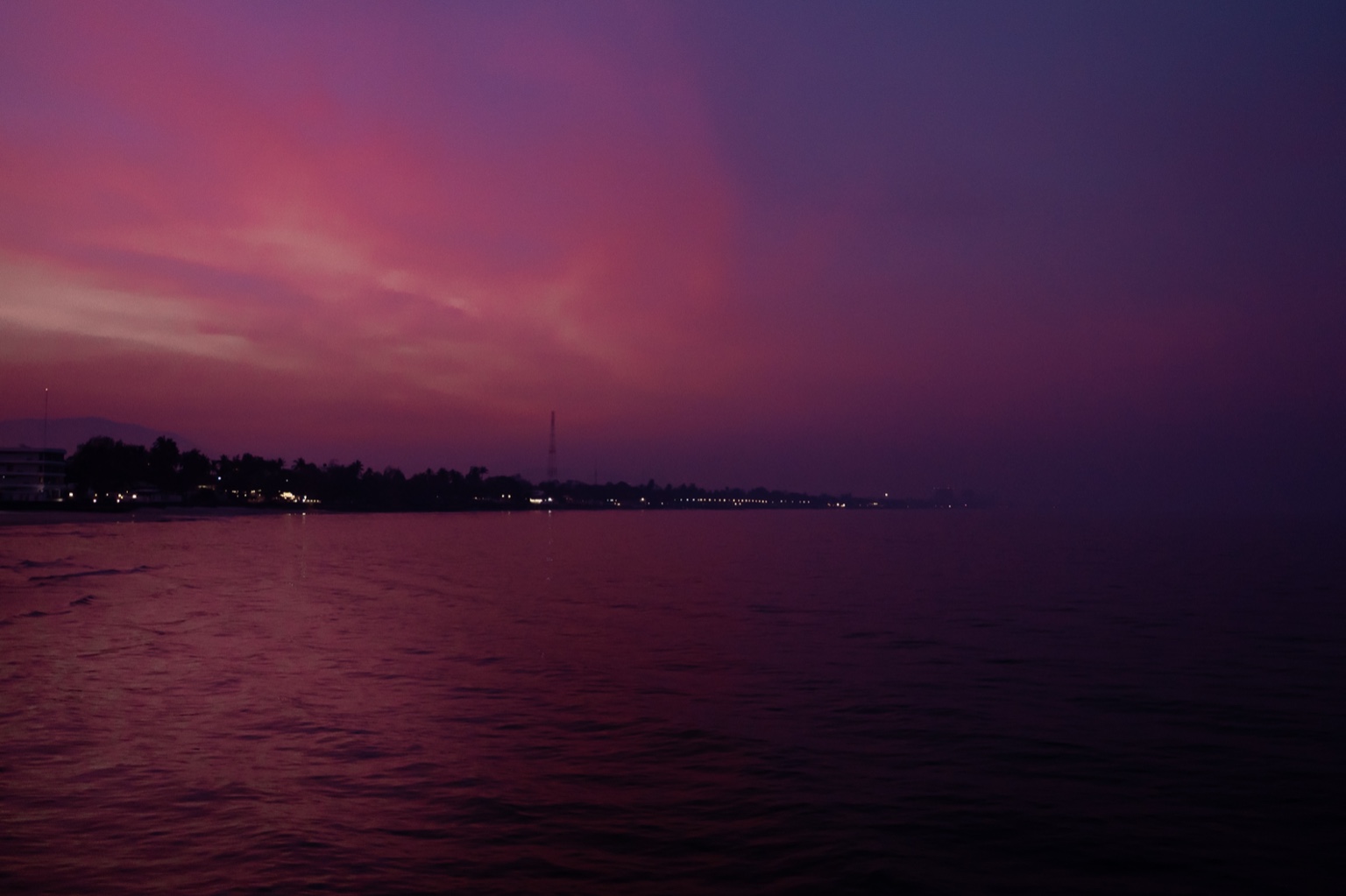 Sunlight fading gently over a quiet landscape, captured in its final golden hue.