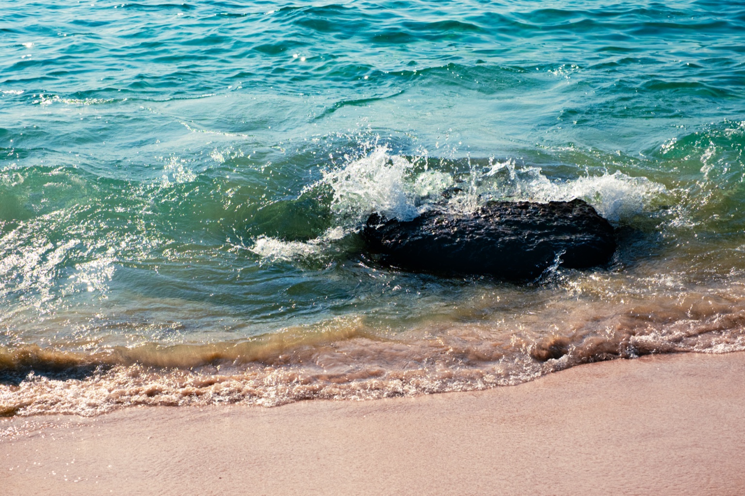 Ocean waves crashing against the rocks — a visual meditation on resilience and calm.